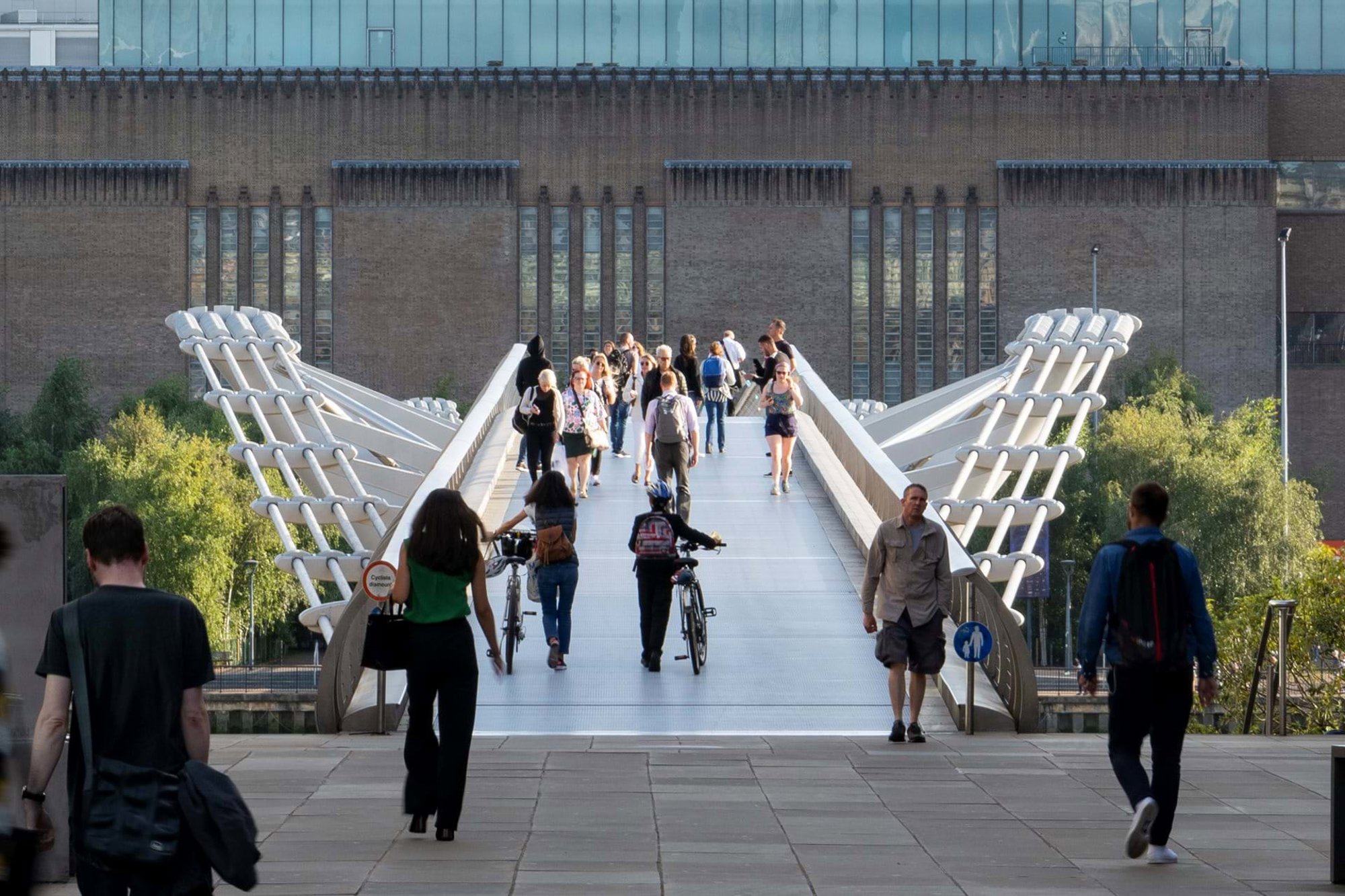 The Millennium Bridge on a busy summer’s day, looking south towards Bankside. More than four million people use the bridge each year. Developed with sculptor Sir Anthony Caro and engineers Arup, it is London's only pedestrian bridge and the first new Thames crossing since Tower Bridge in 1894. © Nigel Young / Foster + Partners