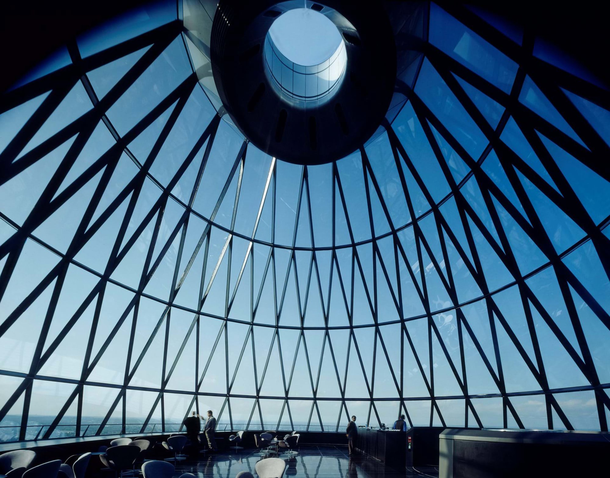 The restaurant at the summit of 30 St Mary Axe, London (2004), offers a spectacular 360-degree sky-filled panorama. © Nigel Young / Foster + Partners
